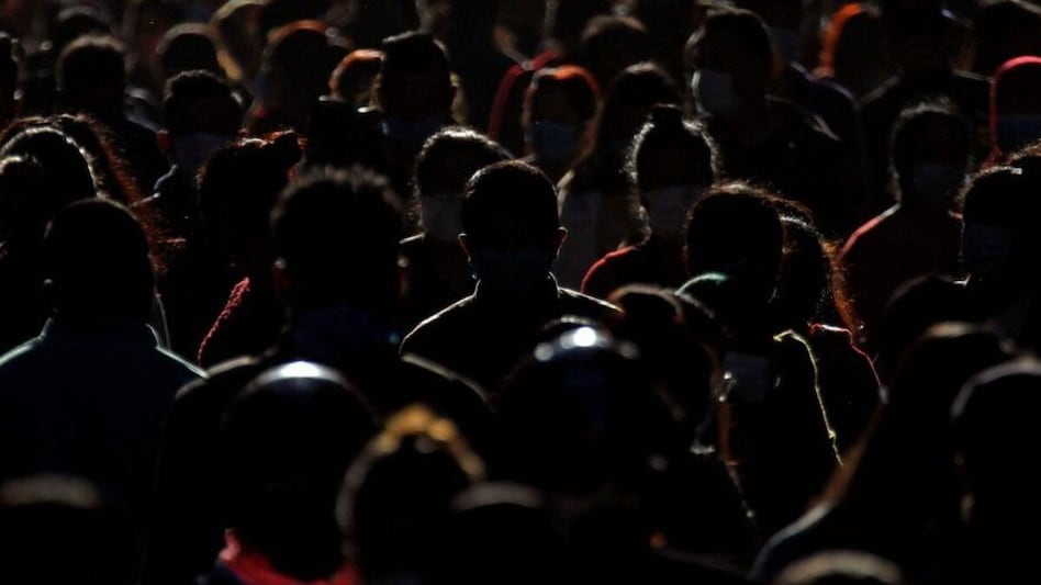 He explains that he feels torn between returning to India and staying in the US for his family. He explains that he feels torn between returning to India and staying in the US for his family.