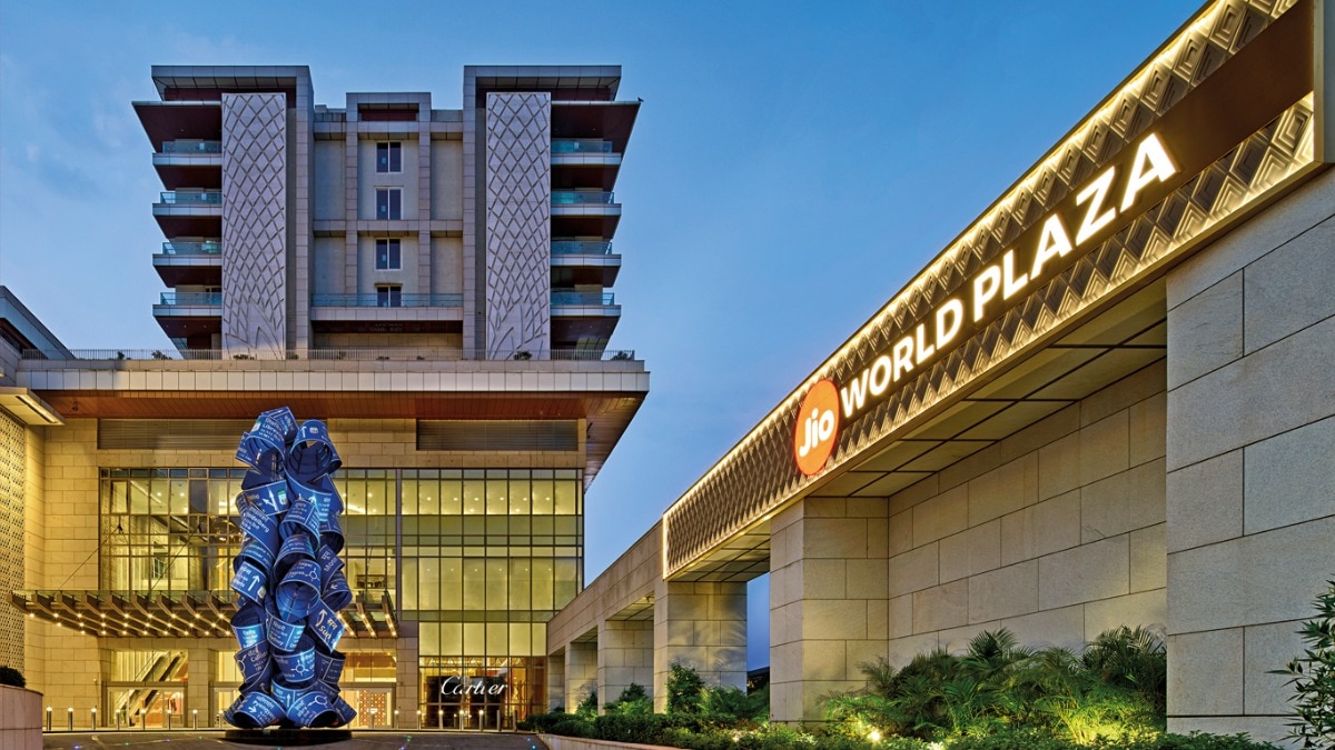 Why are companies like Reliance Industries, the Tata Group, and Aditya Birla Group expanding aggressively in Indian luxury