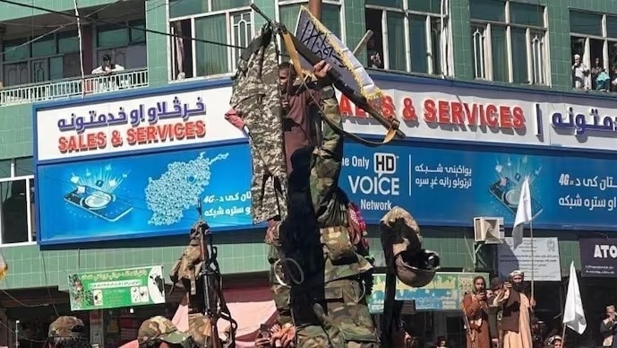 A Taliban fighter hangs trousers and weapons of captured Pakistani troops at multiple places after recent clashes between Pakistan and Afghanistan.