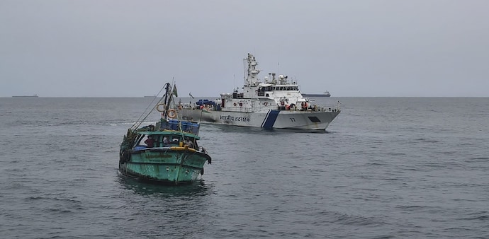 Indian Coast Guard personnel reach out to fishermen at sea, asking them to return to the shores amid a cyclone developing over southeast Bay of Bengal Indian Coast Guard personnel reach out to fishermen at sea, asking them to return to the shores amid a cyclone developing over southeast Bay of Bengal