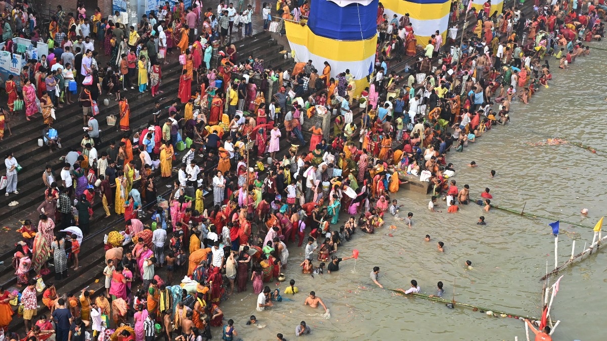 People take a holy dip in the Ganga river as part of Chhath Puja festival rituals in Patna People take a holy dip in the Ganga river as part of Chhath Puja festival rituals in Patna