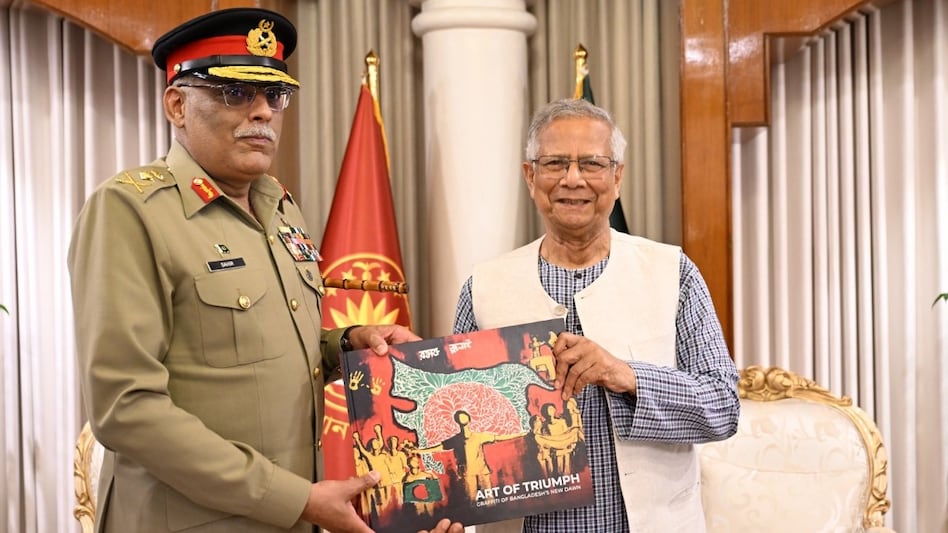 General Mirza with Yunus gifting him a book titled 'Art of Triumph' General Mirza with Yunus gifting him a book titled 'Art of Triumph'