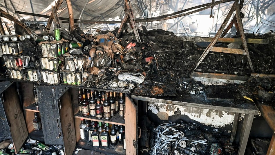 A devastating fire at a Goa nightclub was intensified by its wooden structure and furniture. A devastating fire at a Goa nightclub was intensified by its wooden structure and furniture.