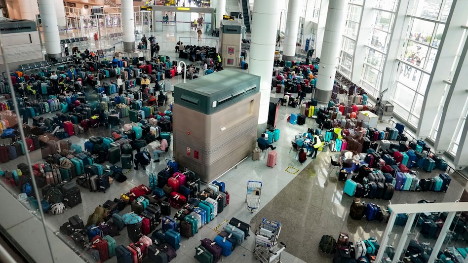 IndiGo crisis: Luggage of passengers piled up at the Indira Gandhi International Airport IndiGo crisis: Luggage of passengers piled up at the Indira Gandhi International Airport