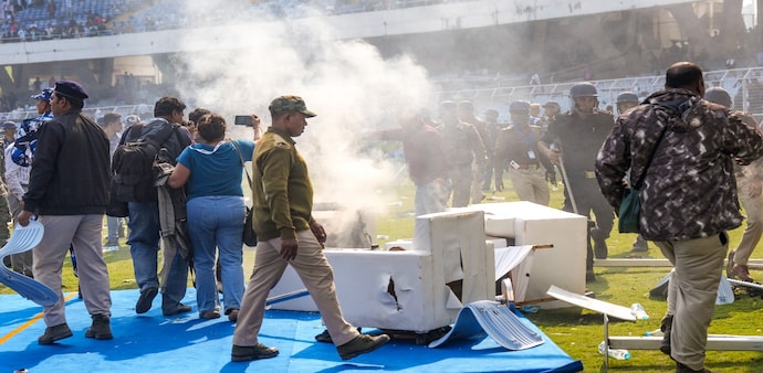 Smoke erupts after chairs were set on fire amid chaos during an event of Lionel Messi as part of his 'G.O.A.T. India Tour 2025' in Kolkata on December 13. Smoke erupts after chairs were set on fire amid chaos during an event of Lionel Messi as part of his 'G.O.A.T. India Tour 2025' in Kolkata on December 13.