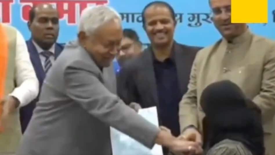 Nitish Kumar pulls down woman's hijab at event Nitish Kumar pulls down woman's hijab at event