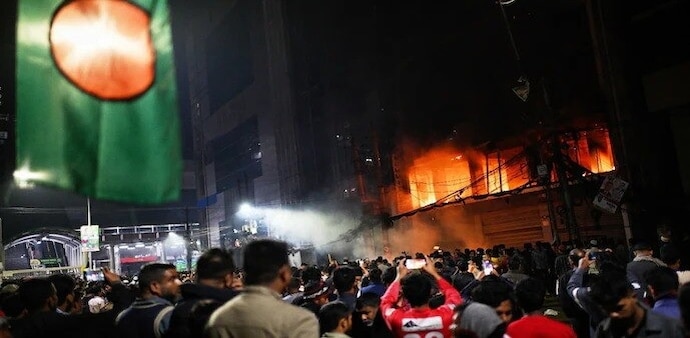 Hadi’s death has triggered widespread unrest across Bangladesh, with reports of mob violence, arson and attacks on media houses in Dhaka and other cities. Hadi’s death has triggered widespread unrest across Bangladesh, with reports of mob violence, arson and attacks on media houses in Dhaka and other cities.
