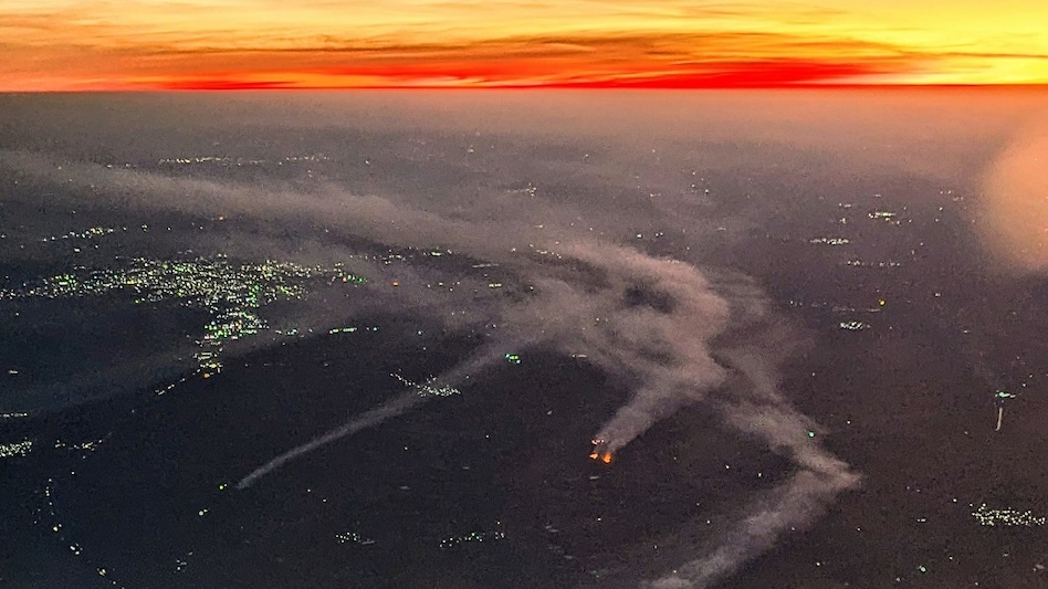 The photos have added to an ongoing debate about how seasonal crop-residue burning, more commonly associated with northern states, can also influence air quality along the western coast. (Photo: @VishalJolapara) The photos have added to an ongoing debate about how seasonal crop-residue burning, more commonly associated with northern states, can also influence air quality along the western coast. (Photo: @VishalJolapara)