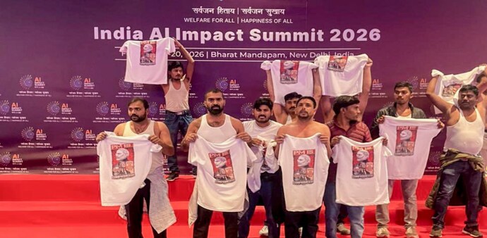 On Friday, workers of the Indian Youth Congress entered the venue of the AI Impact Summit holding T-shirts which had slogans against Prime Minister Narendra Modi and the India-US trade deal. On Friday, workers of the Indian Youth Congress entered the venue of the AI Impact Summit holding T-shirts which had slogans against Prime Minister Narendra Modi and the India-US trade deal.