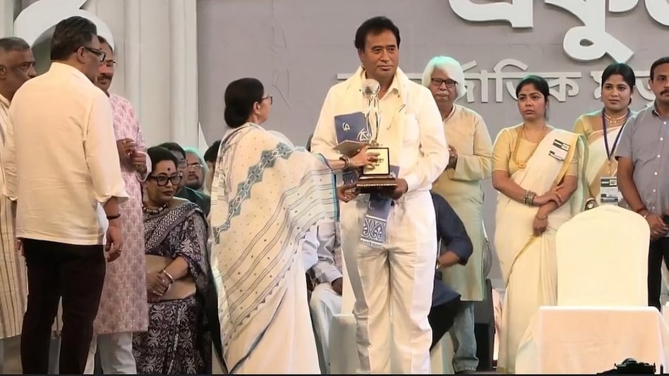 With the Assembly elections due in April-May, the award to Roy has raised questions about Mamata's political calculations. With the Assembly elections due in April-May, the award to Roy has raised questions about Mamata's political calculations.