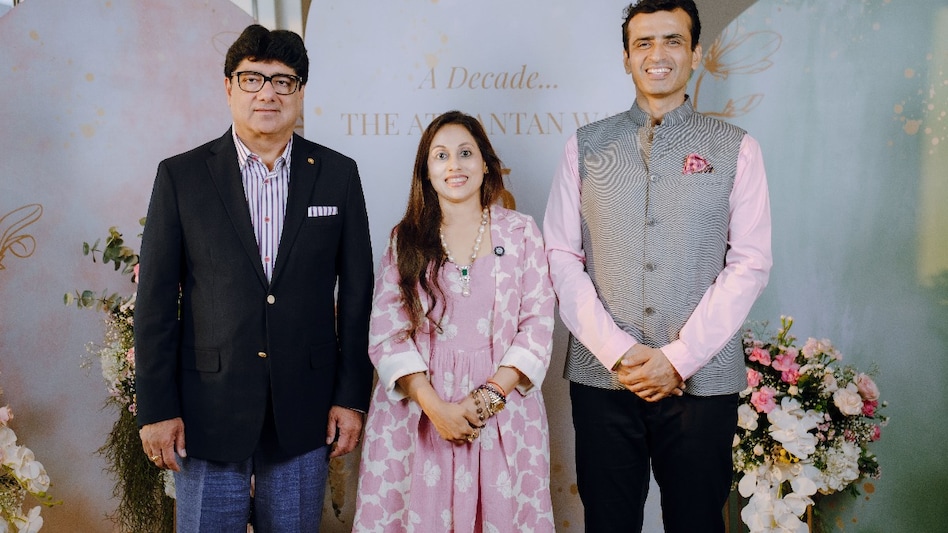 Image Caption L-R - Puneet Chhatwal, Managing Director & CEO, IHCL, Sharmilee Kapur, Founder-Director, Atmantan Wellness Centre with husband Nikhil Kapur. Image Caption L-R - Puneet Chhatwal, Managing Director & CEO, IHCL, Sharmilee Kapur, Founder-Director, Atmantan Wellness Centre with husband Nikhil Kapur.
