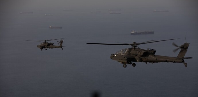 AH-64 Apaches fly above the Strait of Hormuz during a patrol, April 17. (Photo: US Central Command) AH-64 Apaches fly above the Strait of Hormuz during a patrol, April 17. (Photo: US Central Command)