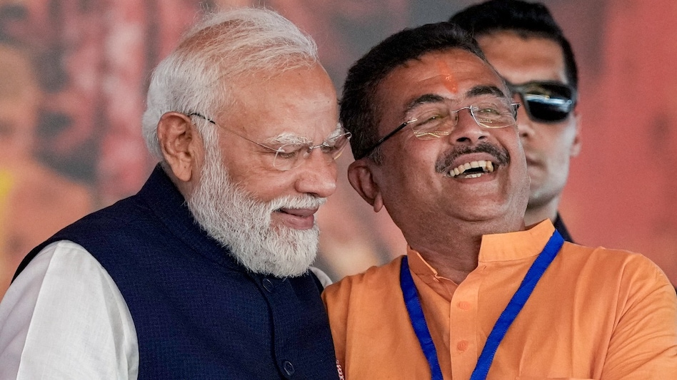 Prime Minister Narendra Modi congratulates newly-sworn West Bengal Chief Minister Suvendu Adhikari after taking oath in Kolkata on May 9. Prime Minister Narendra Modi congratulates newly-sworn West Bengal Chief Minister Suvendu Adhikari after taking oath in Kolkata on May 9.