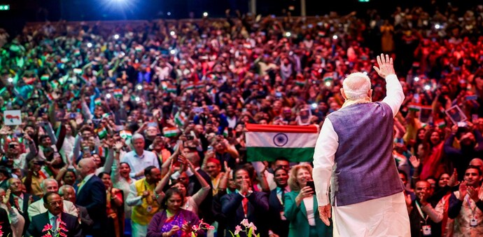 Prime Minister Narendra Modi waves to a gathering during a community programme, in The Hague, Netherlands. Prime Minister Narendra Modi waves to a gathering during a community programme, in The Hague, Netherlands.