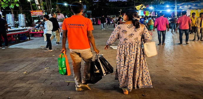 In Delhi's Lajpat Nagar Market, you can now hire someone to carry your shopping bags. In Delhi's Lajpat Nagar Market, you can now hire someone to carry your shopping bags.