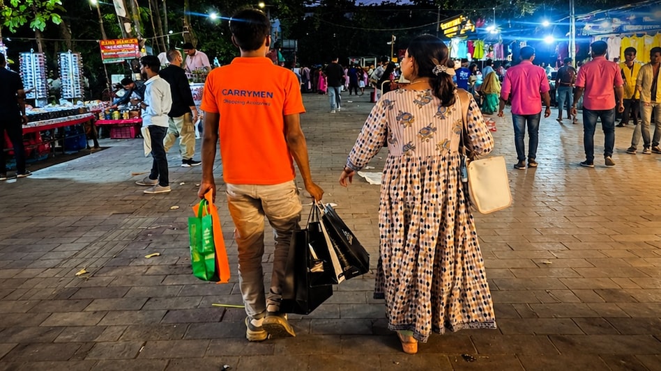 In Delhi's Lajpat Nagar Market, you can now hire someone to carry your shopping bags. In Delhi's Lajpat Nagar Market, you can now hire someone to carry your shopping bags.