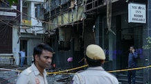 Delhi hotel fire: Owner Lavkesh Bajaj arrested; CM Gupta seeks detailed report, orders probe Delhi hotel fire: Police personnel stand guard near the site of a fire at a hotel in the Malviya Nagar area
