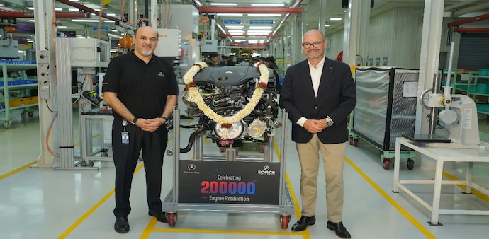 Prasan Firodia and Dr Joerg Burzer with the 200000th Mercedes-Benz engine roll-out Prasan Firodia and Dr Joerg Burzer with the 200000th Mercedes-Benz engine roll-out