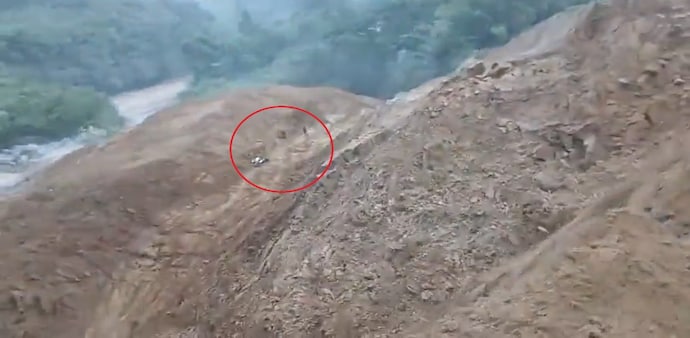 The landslide continues down the slope before spilling into the Siji River below, sending mud and dust into the air. According to the caption shared with the video, the landslide not only carried the biker downhill but also blocked the flow of the river. The landslide continues down the slope before spilling into the Siji River below, sending mud and dust into the air. According to the caption shared with the video, the landslide not only carried the biker downhill but also blocked the flow of the river.