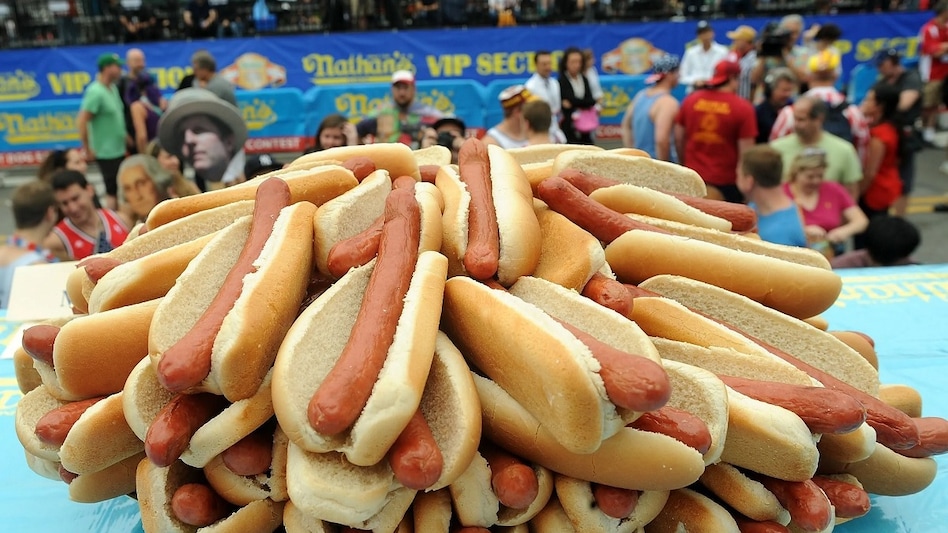 The holiday is also synonymous with one of the world's most famous eating competitions — the Nathan's Hot Dog Eating Contest at Coney Island in New York. The holiday is also synonymous with one of the world's most famous eating competitions — the Nathan's Hot Dog Eating Contest at Coney Island in New York.