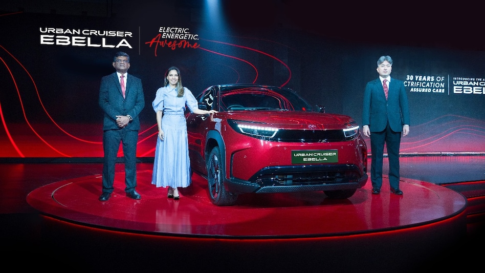 Toyota officials with the Urban Cruiser EBella. Toyota officials with the Urban Cruiser EBella.
