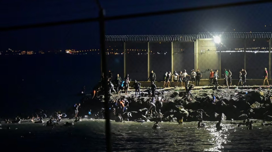 Migrants swim into Spanish city of Ceuta; armed forces deployed