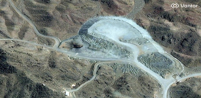 Pickaxe Mountain (known locally in Persian as Kūh-e Kolang) is a hard-rock mountain peak situated approximately 1.5 km south of the main Natanz uranium enrichment complex. Pickaxe Mountain (known locally in Persian as Kūh-e Kolang) is a hard-rock mountain peak situated approximately 1.5 km south of the main Natanz uranium enrichment complex.