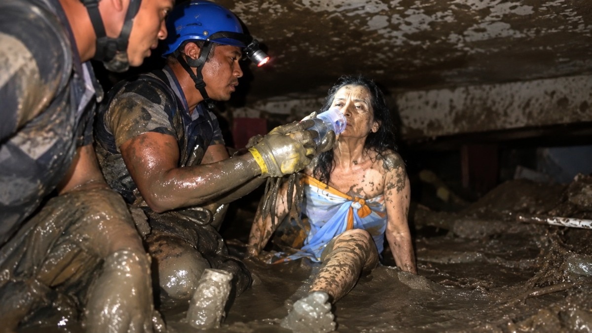 A 60-year-old woman was found alive after spending 10 days trapped beneath mud and debris