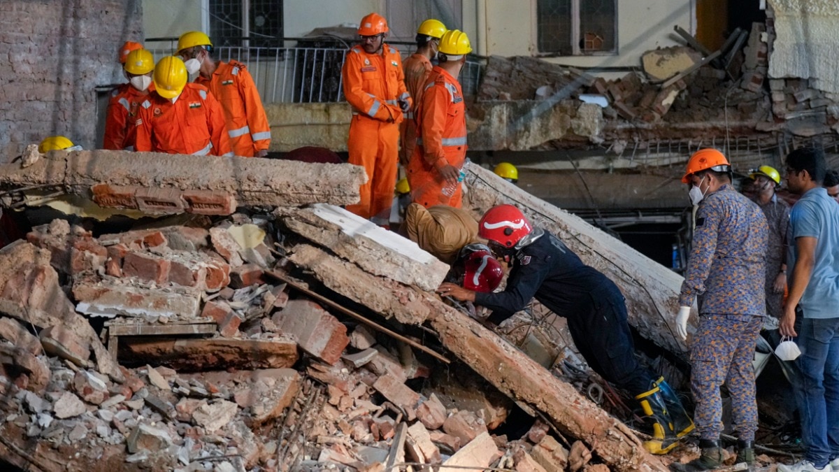 Delhi building collapse: NDRF, fire department officials during a rescue operation
