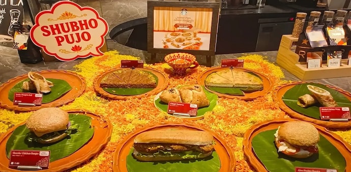 The food menu includes the Shorshe Chicken Burger, Kosha Mangsho Roll, Bhekti Bhaja Sandwich, Dhakai Chicken Wrap, Aloo Postho Burger and Chingri Turnover. The food menu includes the Shorshe Chicken Burger, Kosha Mangsho Roll, Bhekti Bhaja Sandwich, Dhakai Chicken Wrap, Aloo Postho Burger and Chingri Turnover.
