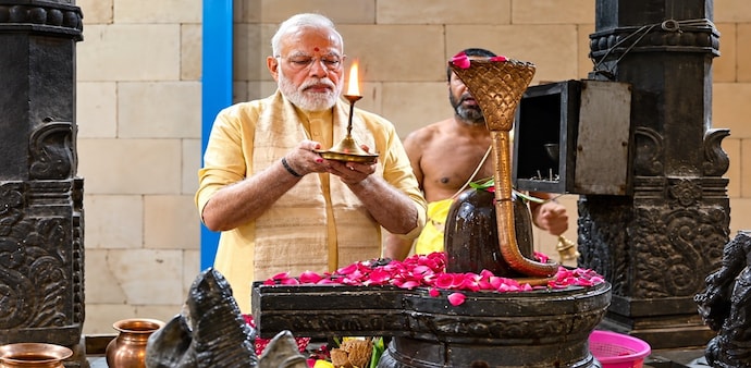 Narendra Modi offered prayers at Shri Vinayak Mandir in Delhi as he completed 25 years of uninterrupted leadership in government. Narendra Modi offered prayers at Shri Vinayak Mandir in Delhi as he completed 25 years of uninterrupted leadership in government.
