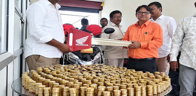 Telangana pastor B Ravi Joseph buys a Honda Activa with Rs 10 coins saved over three years. Telangana pastor B Ravi Joseph buys a Honda Activa with Rs 10 coins saved over three years.