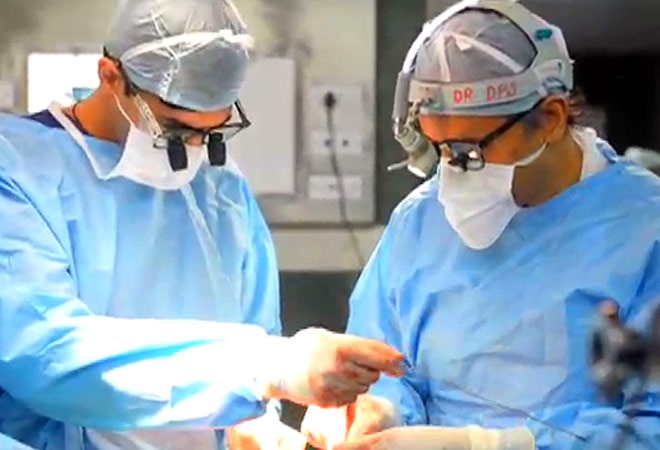 At work: Narayana Health's Devi Shetty performs a surgery