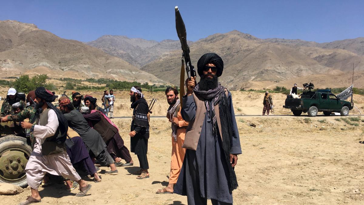 Taliban fighter holds a gun