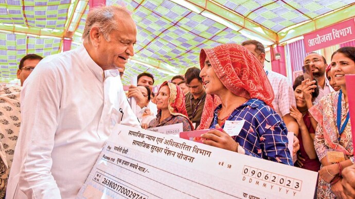 FOURTH TERM IN MIND: CM Ashok Gehlot distributing social security pension in Sikar.