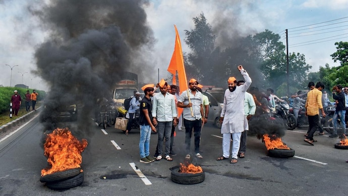 BURNING FURY: Maratha Kranti Morcha members block the Pune-Solapur Highway to protest the lathi-charge on their cohort in Jalna district, Sept. 6 (Photo: PTI)