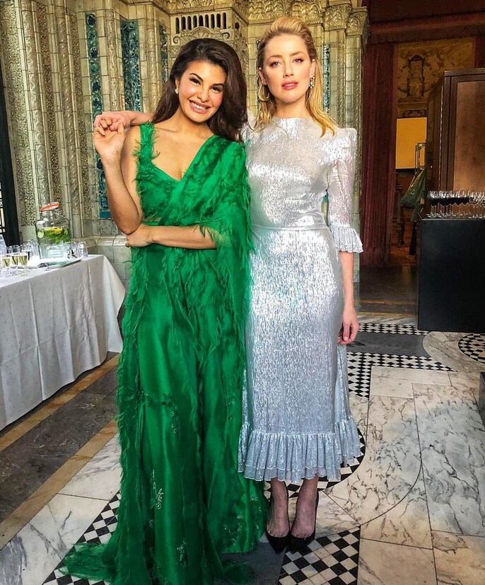 amber heard green dress Amber Heard wore a green dress and matching hat to the London Aquaman premiere