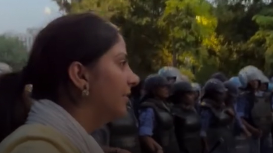 Whistles rang out as journalists tried to record the police action