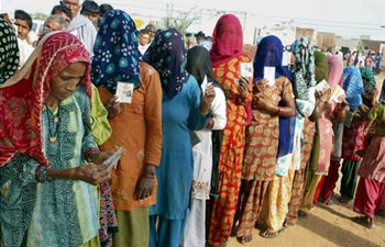 Women in queue to cast their votes in Hisar.