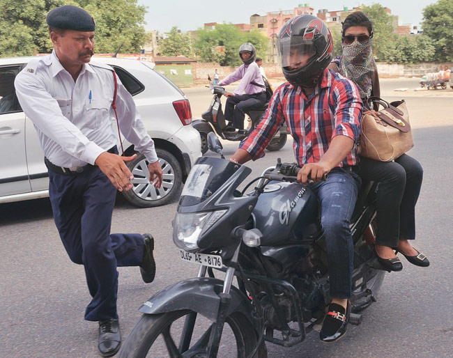Traffic Police fines 5000 women for not wearing helmets India Today