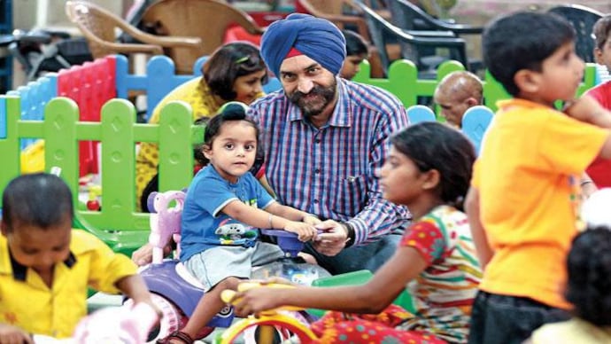 Dr Chhhatwal at the playroom in PGI. Photograph by Sandeep Sahdev