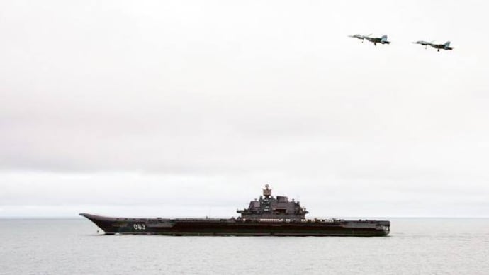 Jet fighters fly over the Russian aircraft-carrier