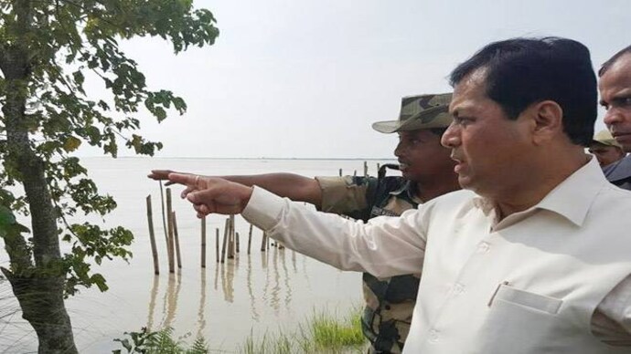 Assam CM Sarbananda Sonowal visited flood affected areas in South Salmara-Mankachar. (Photo: ANI)