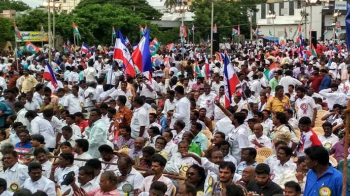 Fans and supporters of Rajinikanth arrive at the venue of a meeting in Trichy