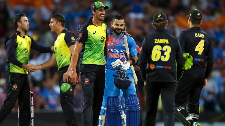 Sydney T20I: Kohli, Dhawan help India gun down 165 to draw series vs Australia