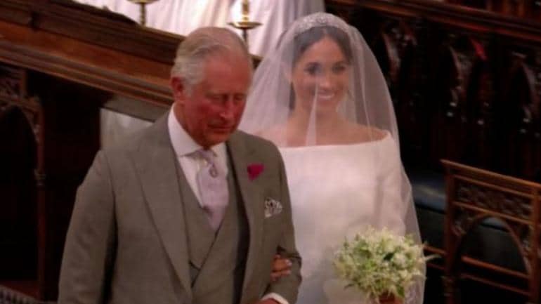 Prince Charles framed the memorable photo of him walking Meghan down