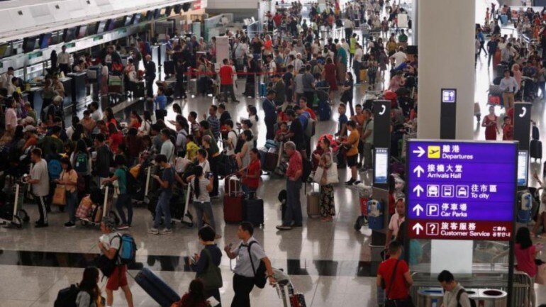 Hong Kong airport reopens after protests but more than 200 flights cancelled