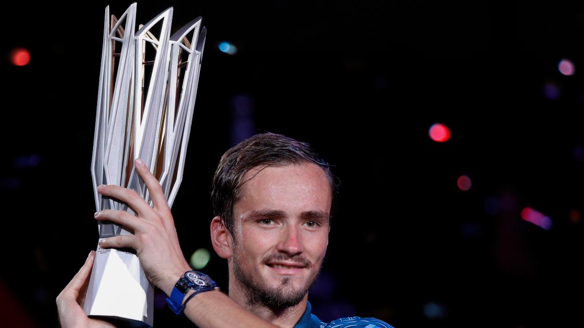 Daniil Medvedev of Russia, right, poses after winning the final