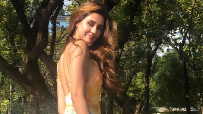 Disha Patani basks under Bangkok sun in a backless yellow floral dress. See pics - India Today Disha Patani basks under Bangkok sun in a backless yellow floral dress. See pics - India Today