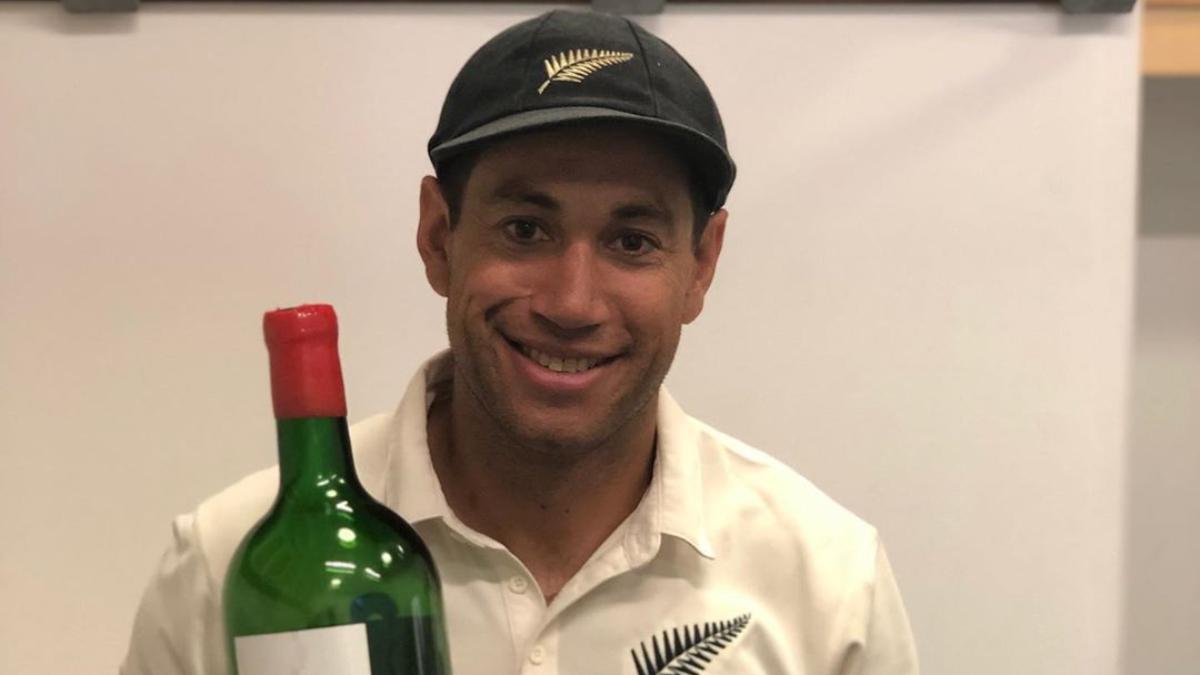 Teammates help Ross Taylor finish big bottle of wine to celebrate Wellington Test win